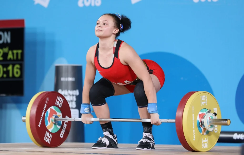 Close view of a lifter's stance and weightlifting shoes before a clean