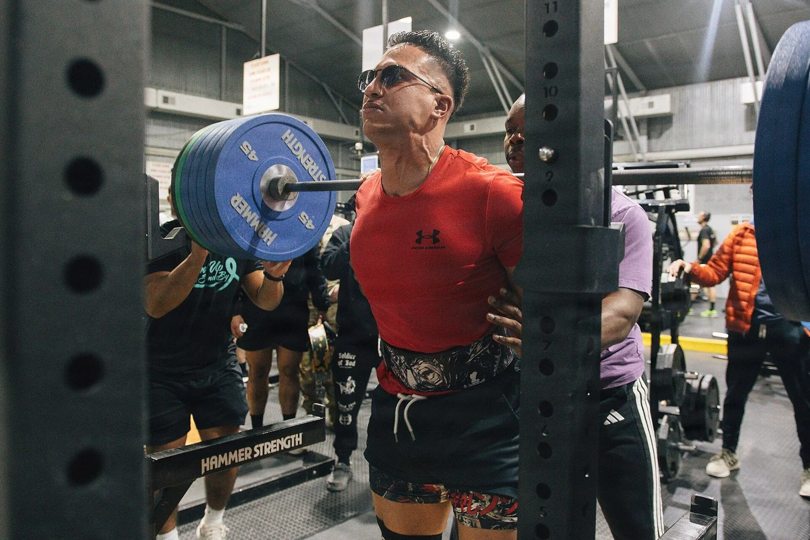 Powerlifter walking a squat out of the rack at a meet